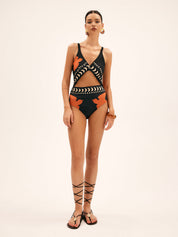 One-piece swimsuit black with orange and white patterns, side view