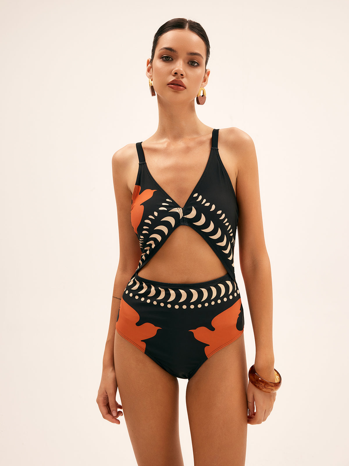 One-piece swimsuit black with orange and white patterns, front profile view