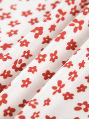 Maxi dress white with red floral pattern fabric texture close-up