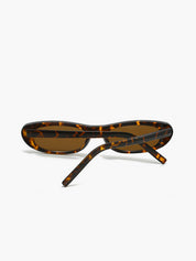 Sunglasses with tortoiseshell pattern and brown lenses, side view