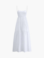 White maxi dress with thin straps and tiered skirt, front view