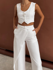 Two-piece set white side view with hands on hips