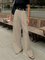 Beige wide-leg trousers front view with belt