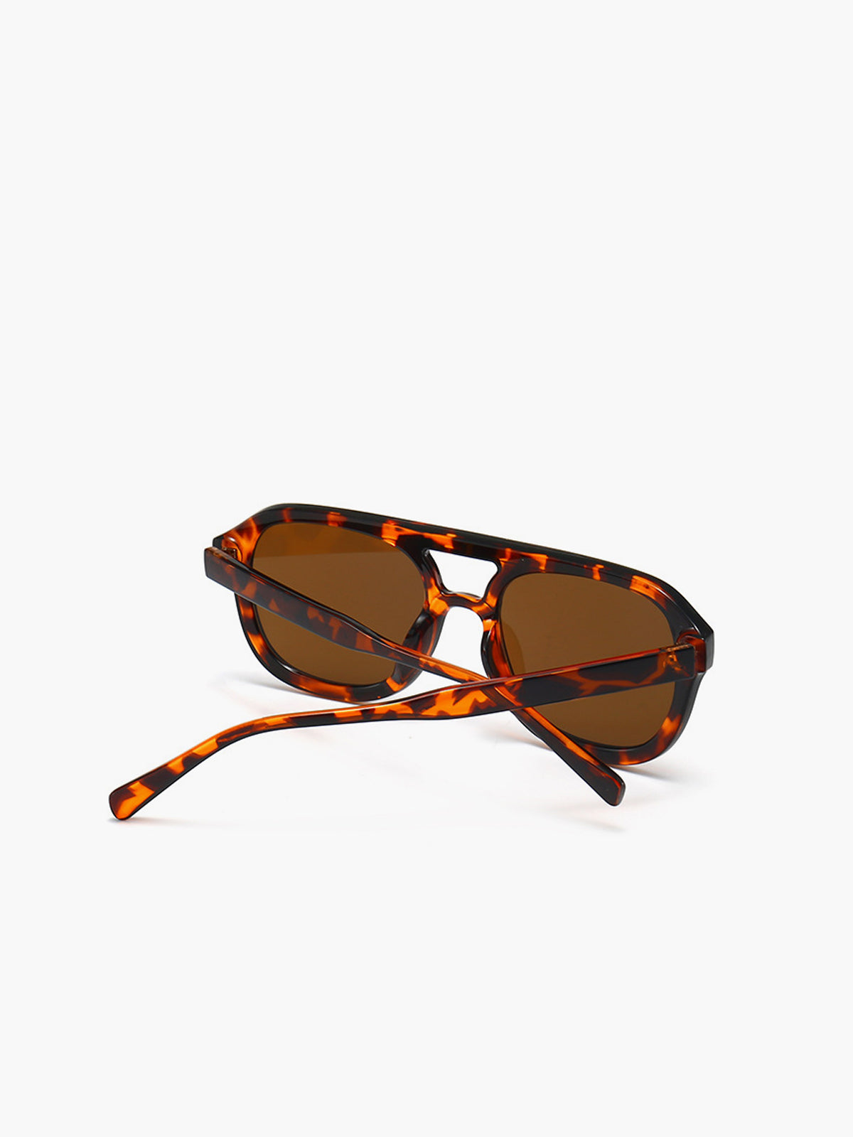 Sunglasses brown tortoiseshell frame side view isolated
