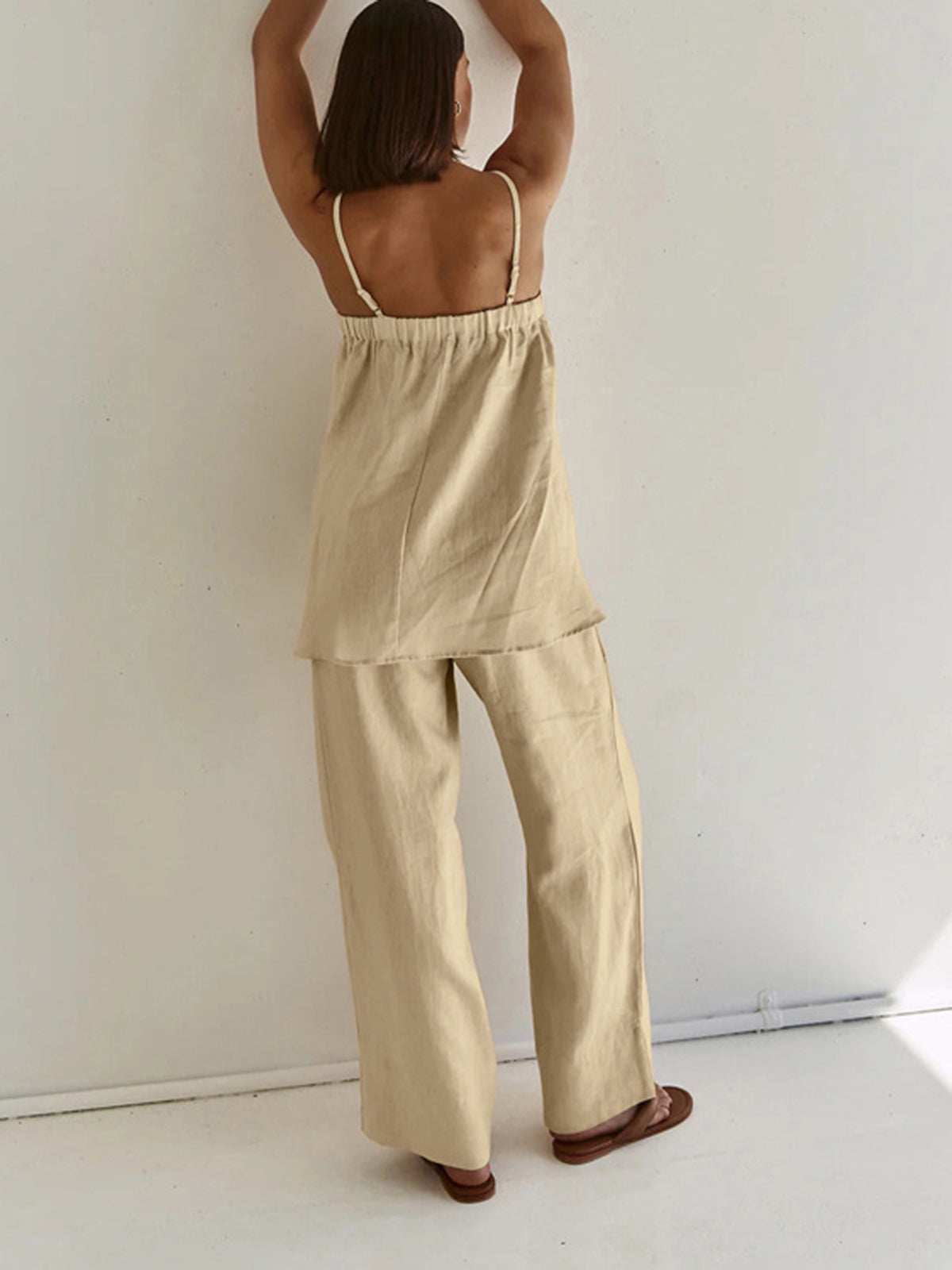 Beige loungewear set with tiered top and wide-leg pants back view