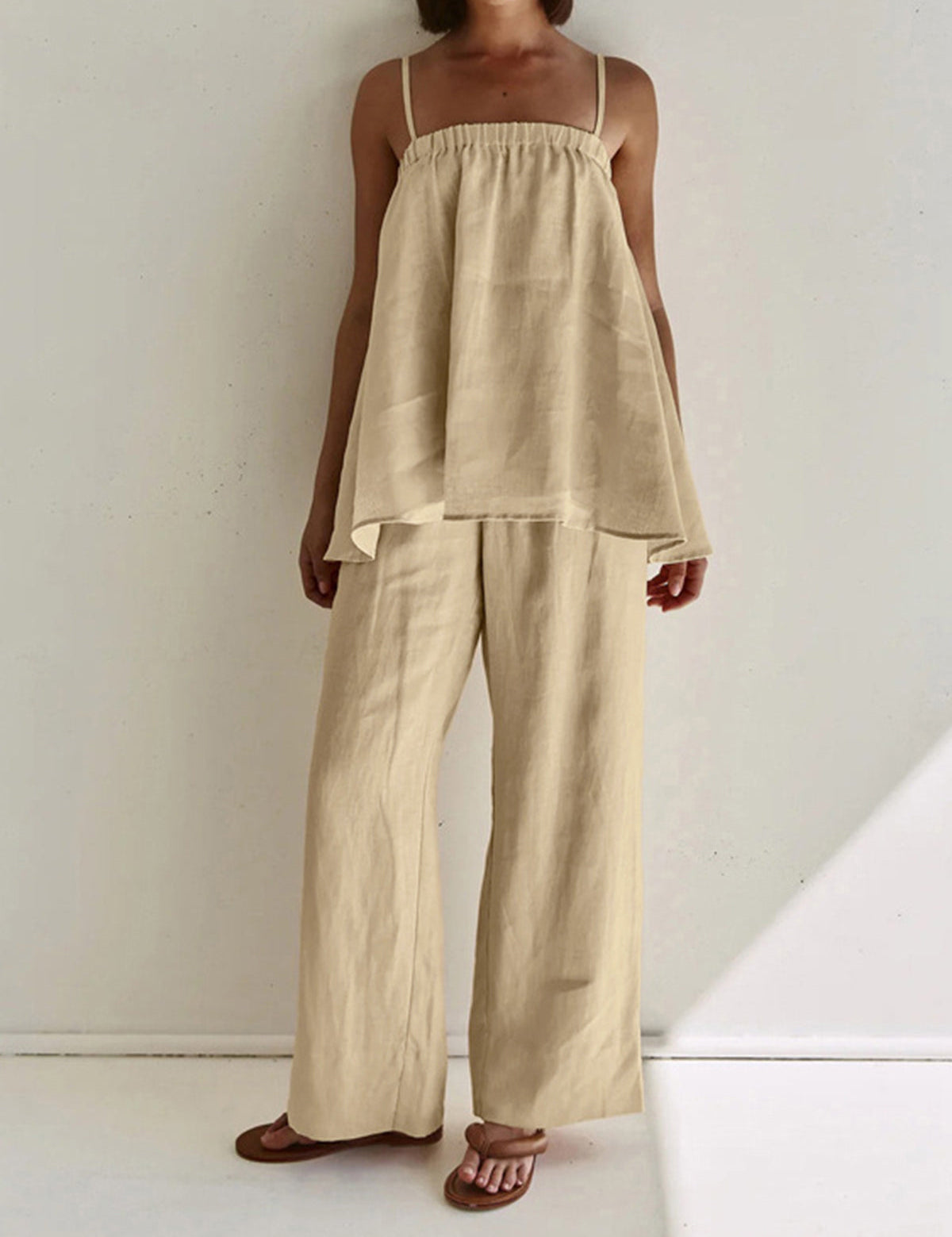 Beige loungewear set with tiered top and wide-leg pants front view