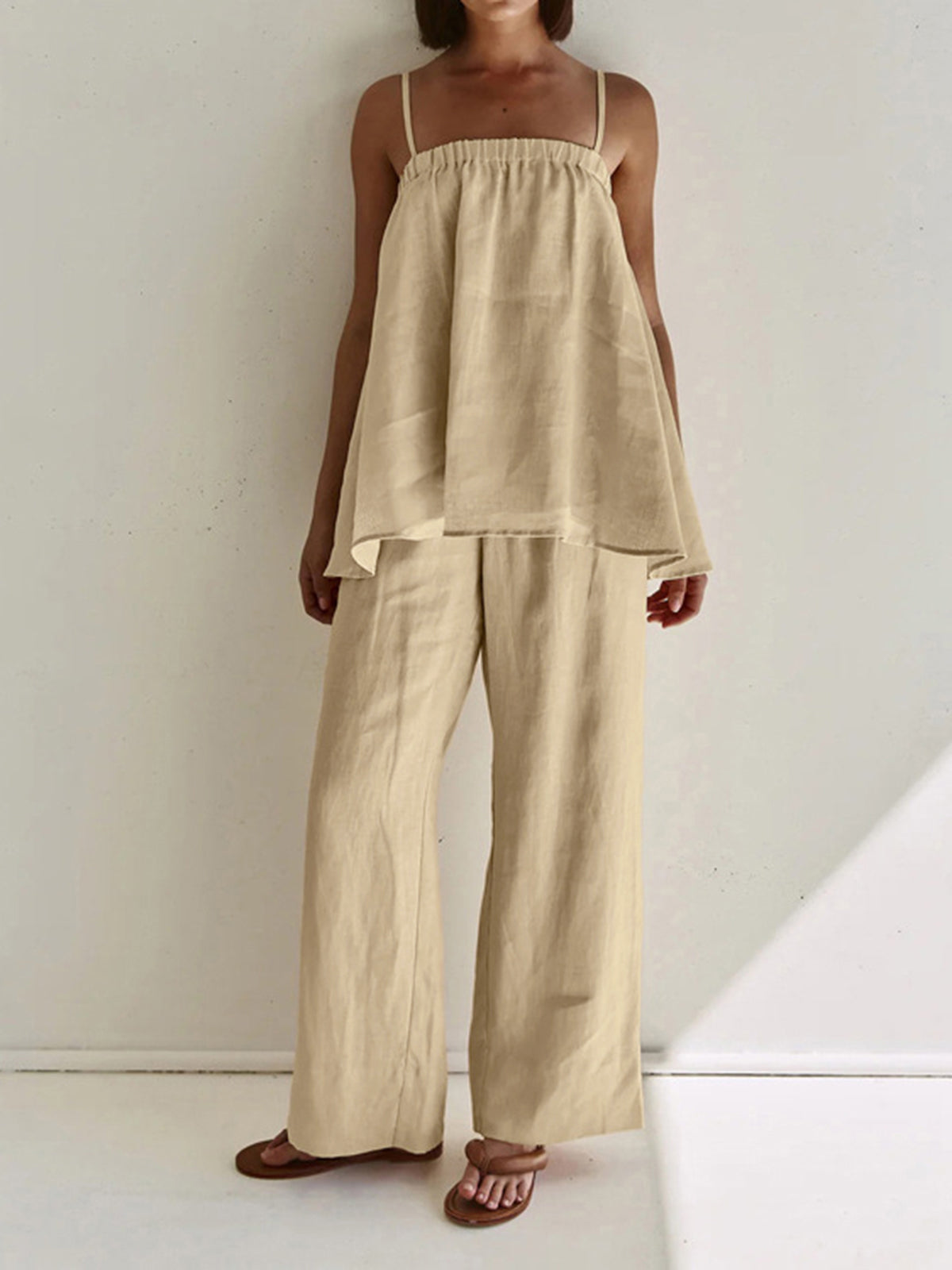 Beige loungewear set with tiered top and wide-leg pants front view