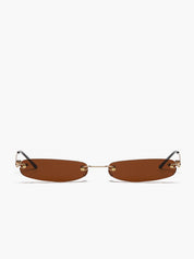 Sunglasses with brown lens and gold frame, top-down view