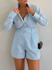 Light blue linen co-ord set front view with hands adjusting collar