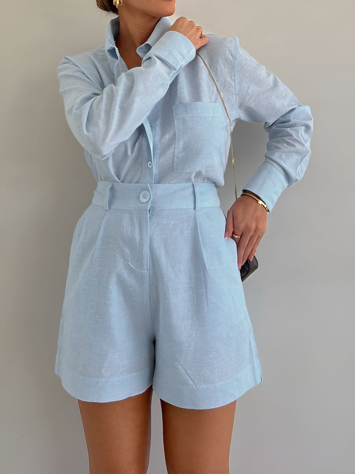 Light blue linen co-ord set side view with hand in pocket