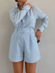 Light blue linen co-ord set side view with hand in pocket