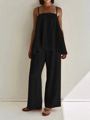 Black loungewear set with tiered top and wide-leg pants front view