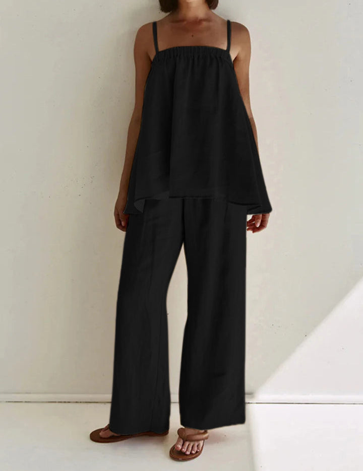 Black loungewear set with tiered top and wide-leg pants front view