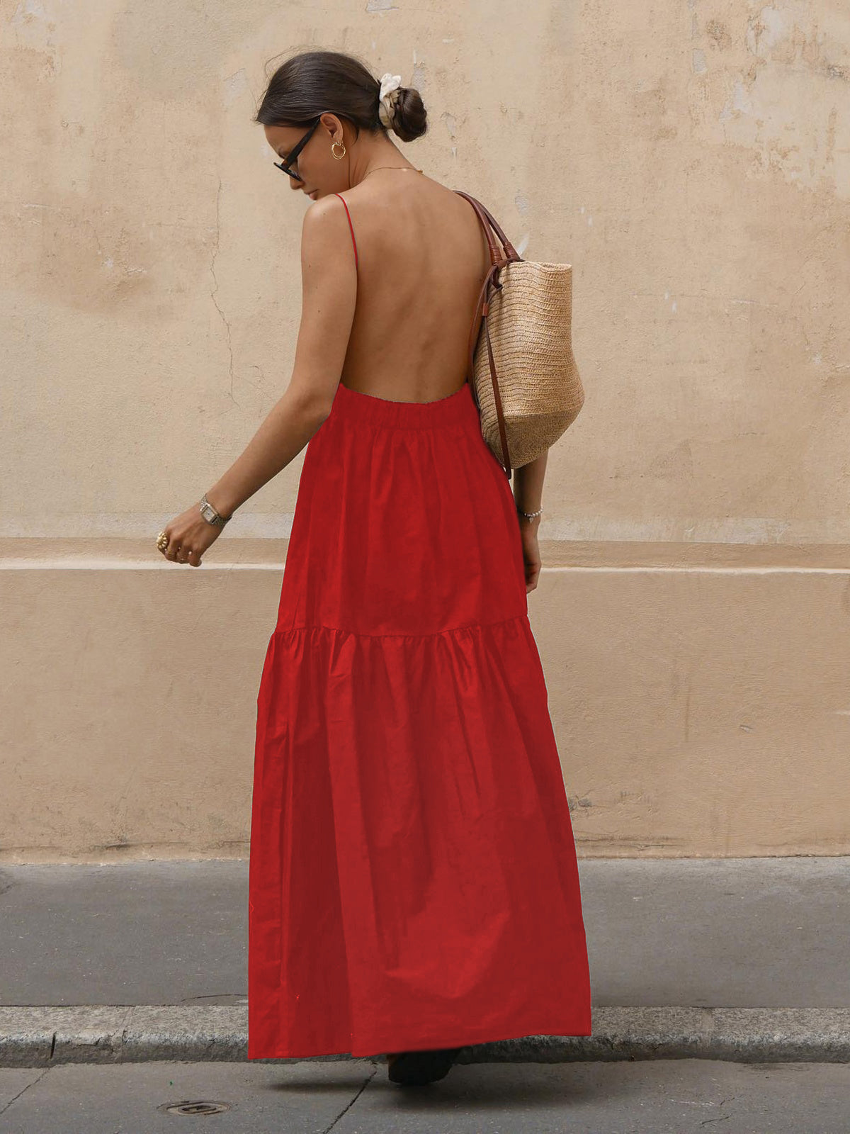 Red maxi dress with open back and thin straps, side view