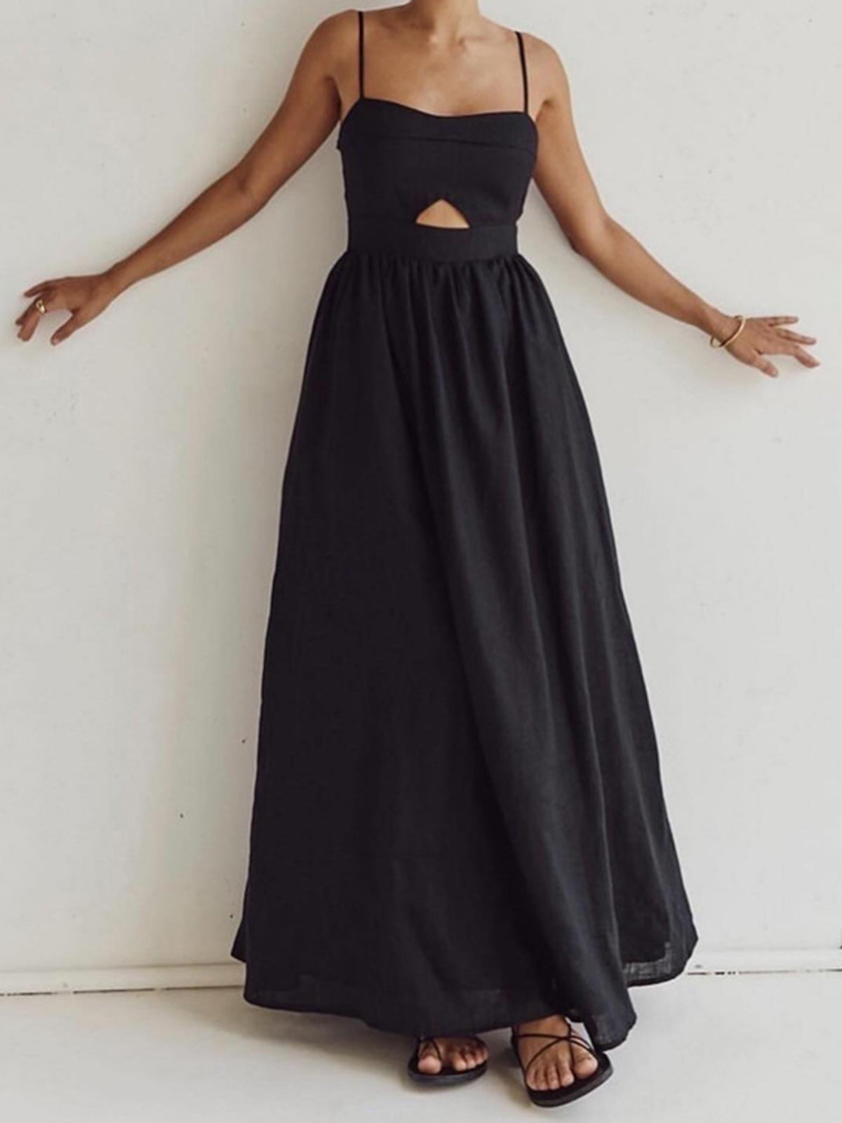 Black maxi dress with cutout detail and pockets front view