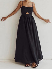 Black maxi dress with cutout detail and pockets front view