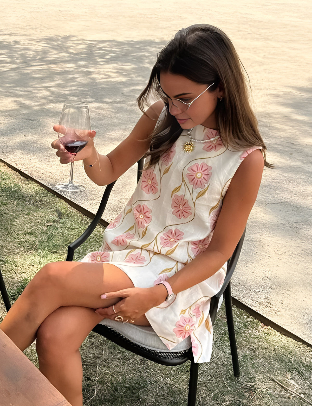 Summer dress with pink floral print, sleeveless, front view