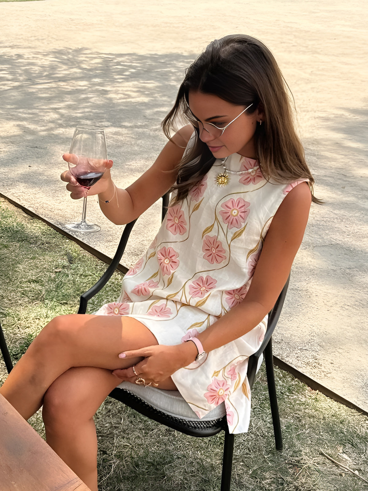 Summer dress with pink floral print, sleeveless, front view
