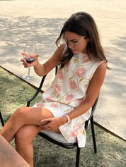 Summer dress with pink floral print, sleeveless, front view