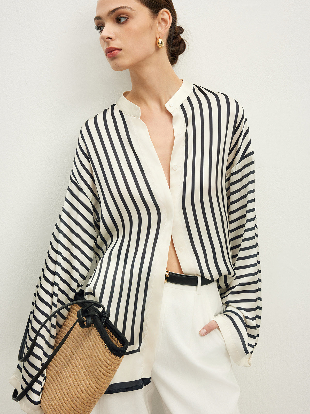 Striped satin blouse with wide sleeves close-up side
