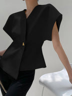 Black V-neck top with gold button detail, side view