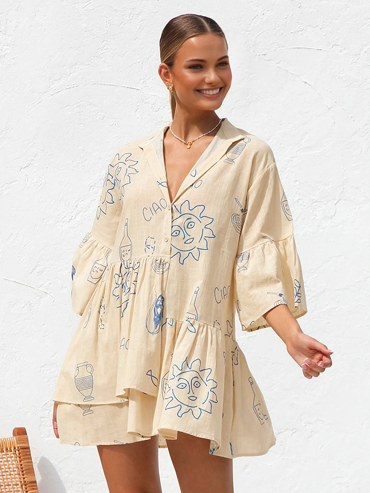 Summer dress with blue sun and bottle print front view