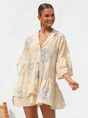 Summer dress with blue sun and bottle print front view
