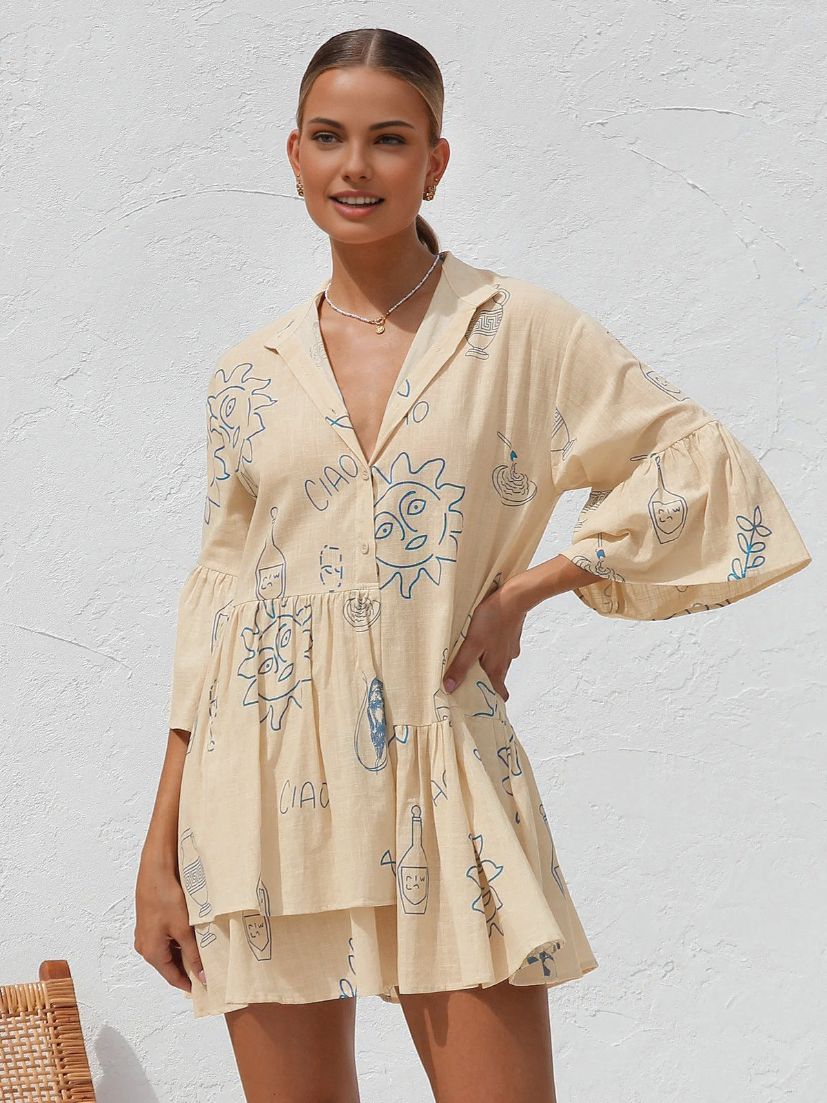 Summer dress with blue sun and bottle print front pose