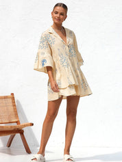 Summer dress with blue sun and bottle print side profile
