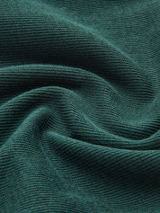 Broek stof groen met rimpeltextuur detailopname