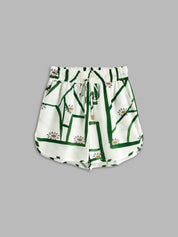 Loungewear shorts white with green pattern flat lay