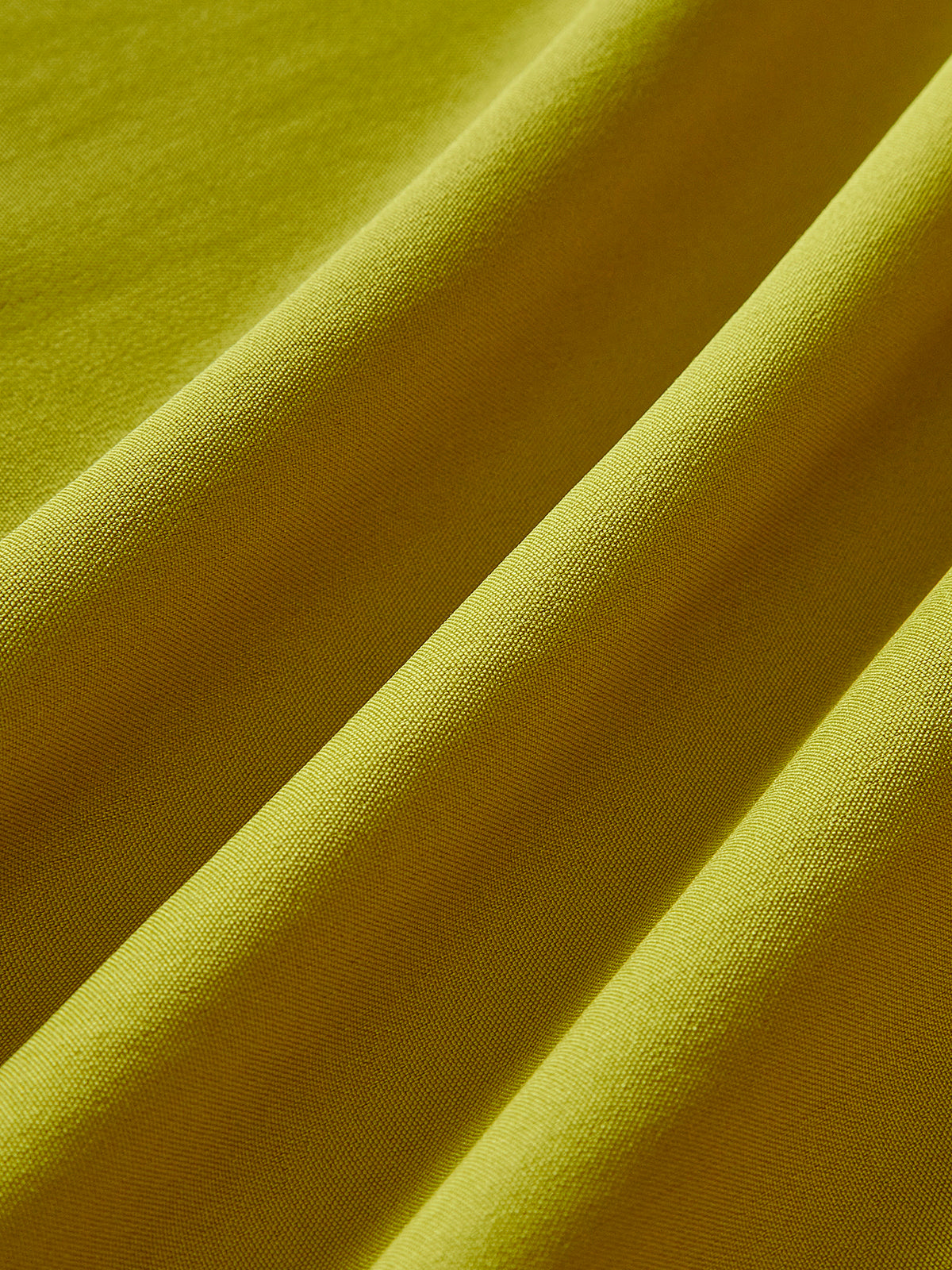 Green cocktail dress fabric texture, close-up
