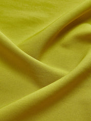 Green cocktail dress fabric detail, close-up