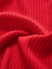 Red ribbed cardigan fabric texture close-up