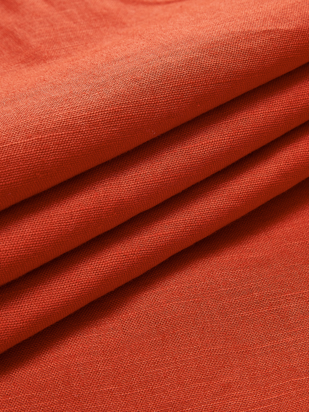 Orange linen dress fabric texture close-up