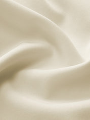 Pleated skirt fabric detail, white close-up