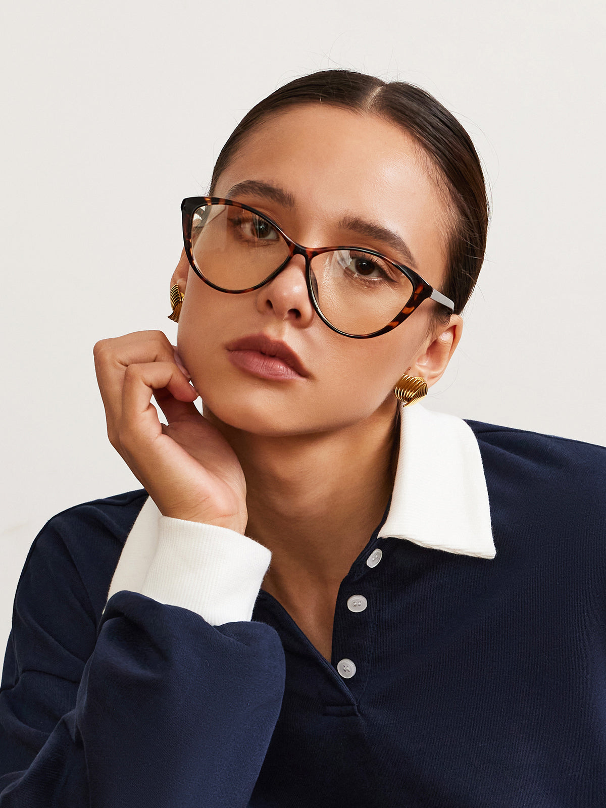 Glasses with tortoiseshell pattern worn by model, front view