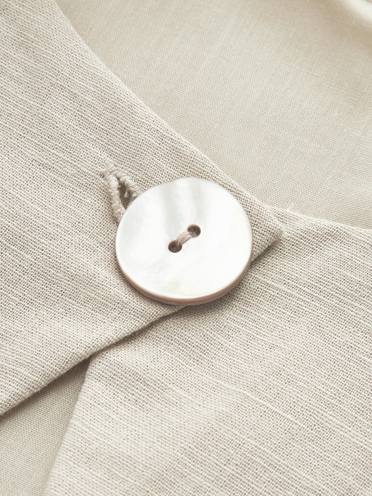 Maxi dress beige button detail close-up