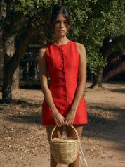 Red sleeveless dress with buttons front view