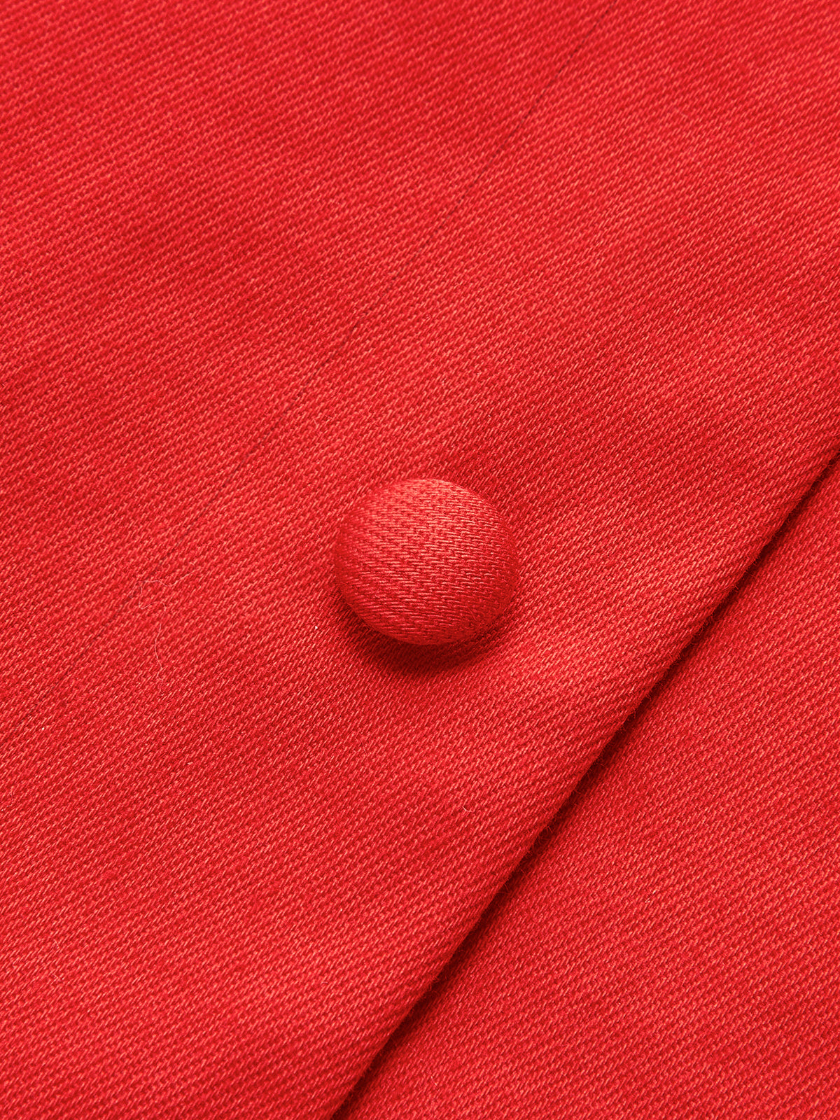 Red dress button close-up detail