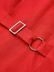 Red dress belt buckle close-up detail