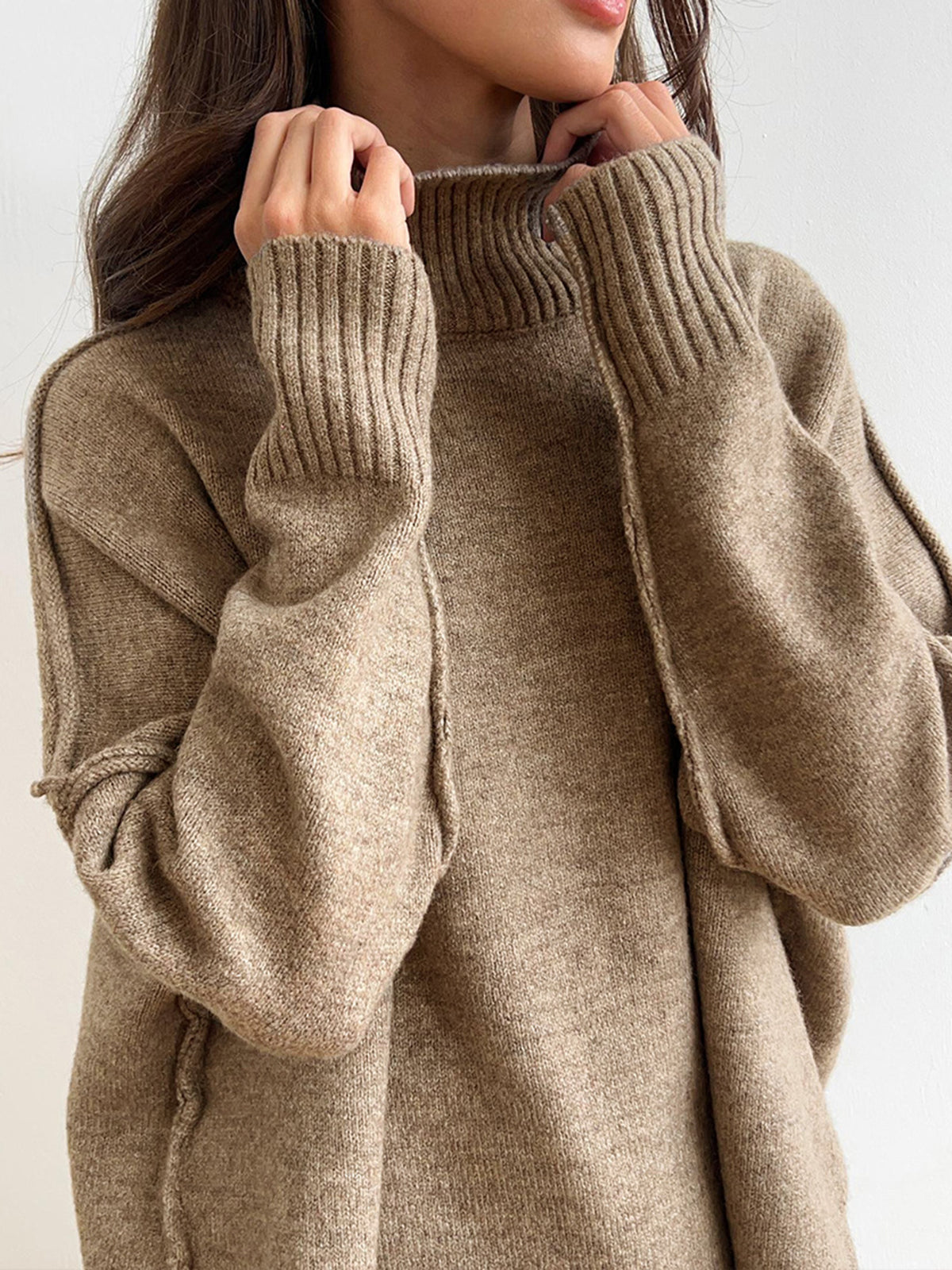 Beige knit sweater close-up of turtleneck and texture