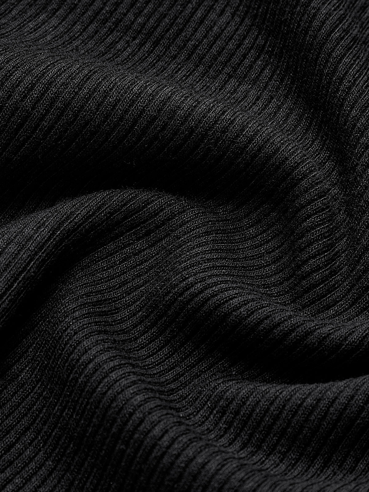Black ribbed top fabric texture detail