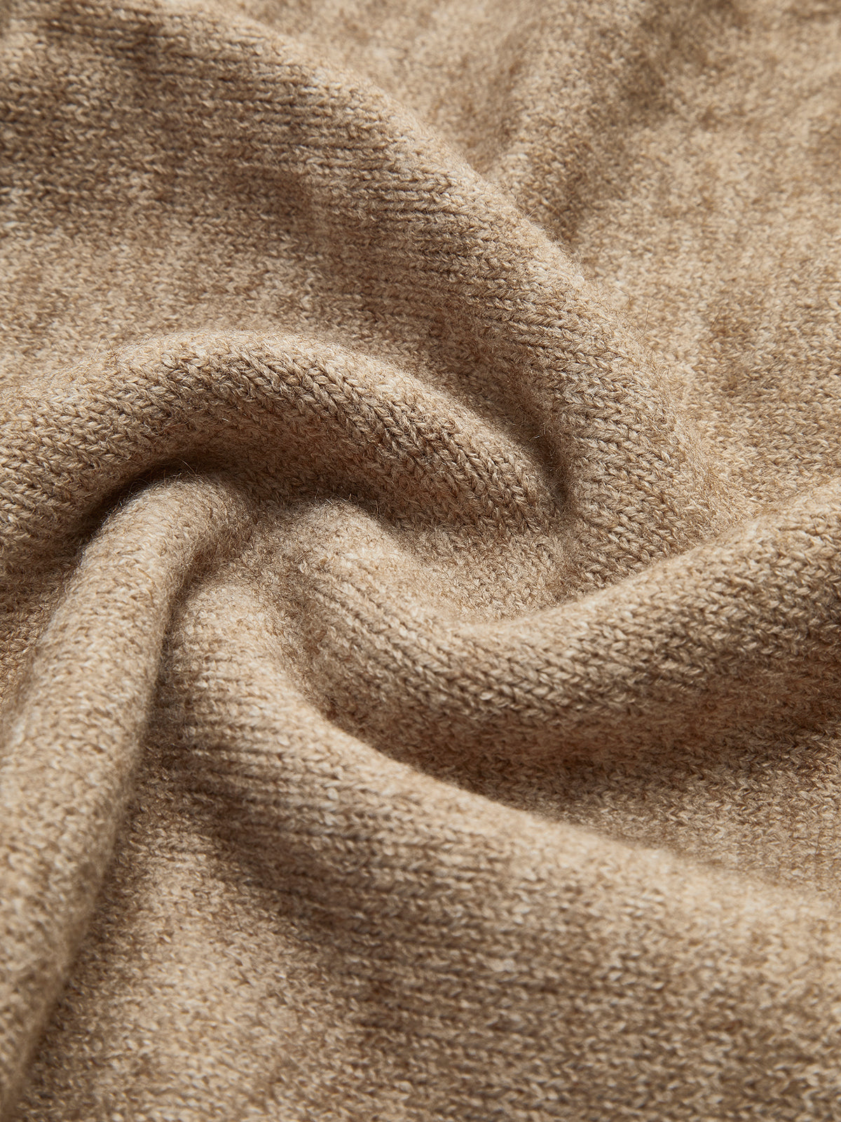 Beige knit sweater close-up of sleeve and turtleneck