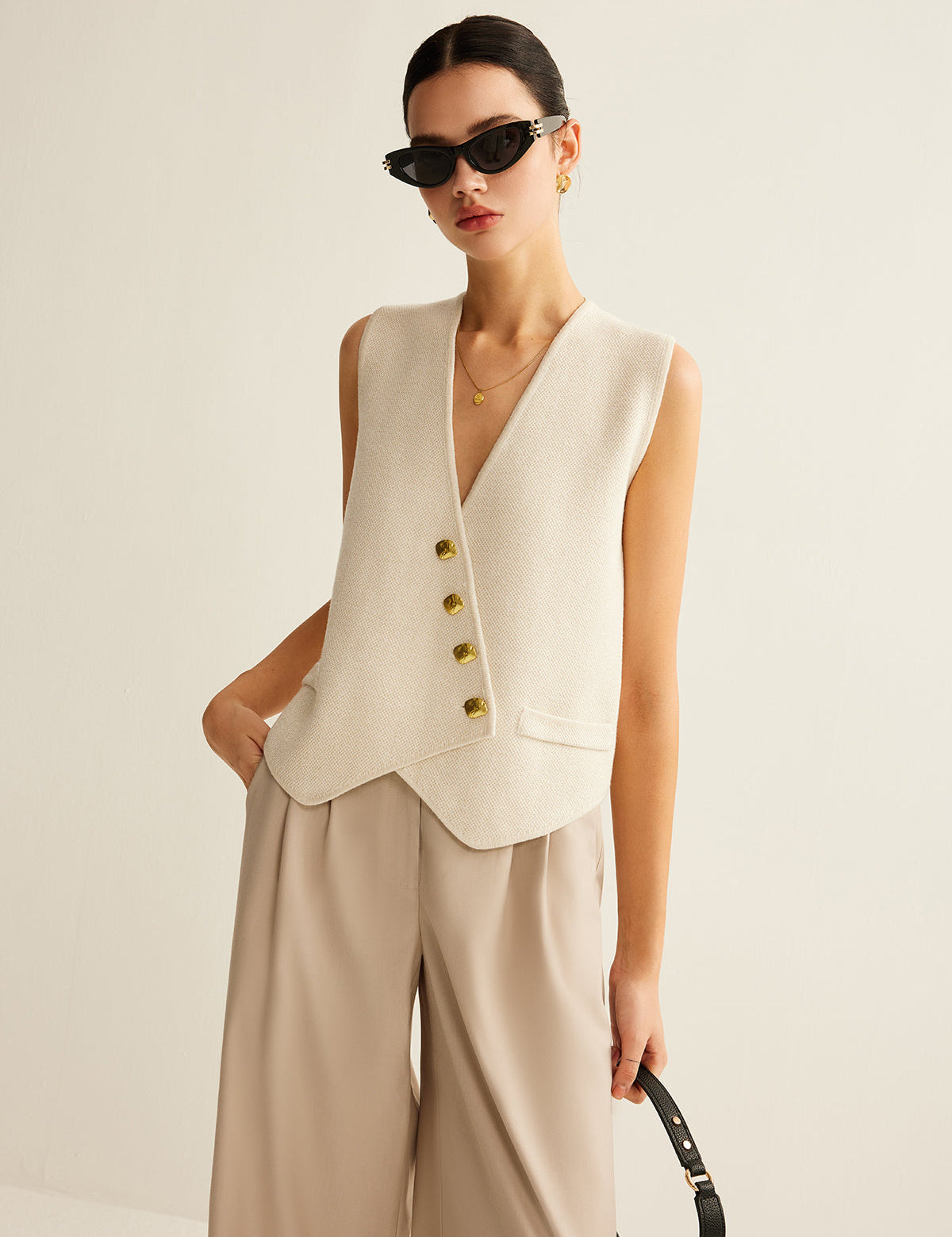 Cream vest with gold buttons front view
