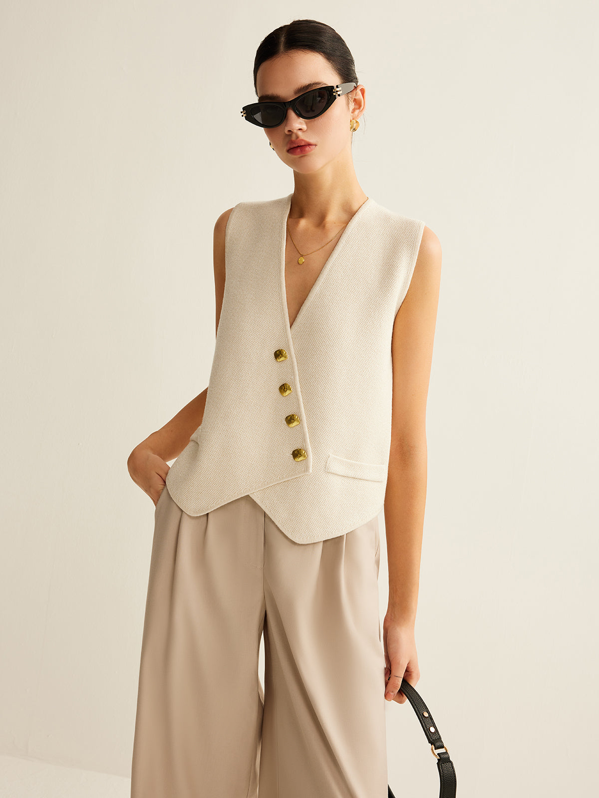 Cream vest with gold buttons front view
