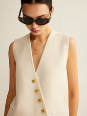 Cream vest with gold buttons close-up front view