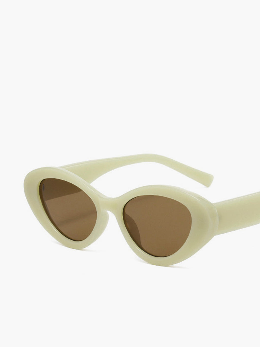 Sunglasses, oval cat eye silhouette, beige frame, angled view