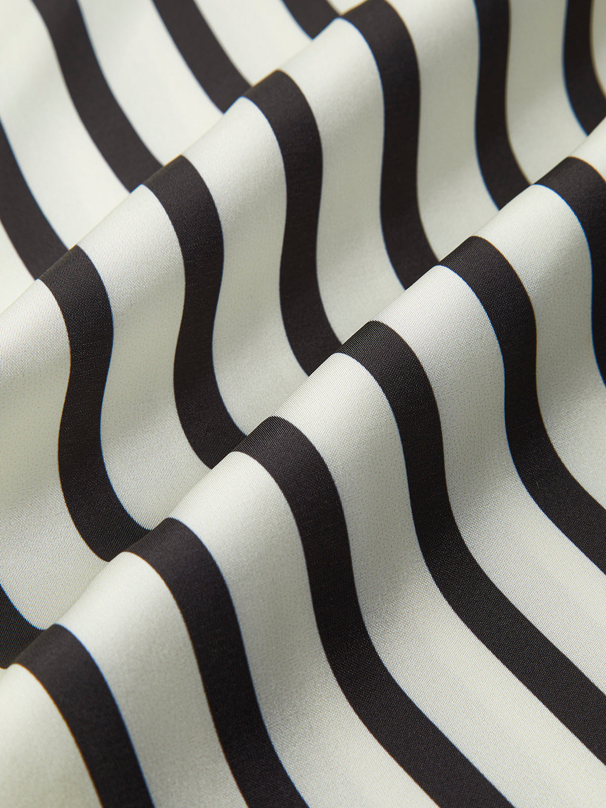 Striped satin blouse with wide sleeves fabric texture close-up