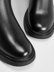 Black leather knee-high boots sole detail